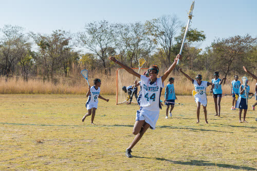 A young player celebrates during a SALP schools lacrosse match in Vaalwater