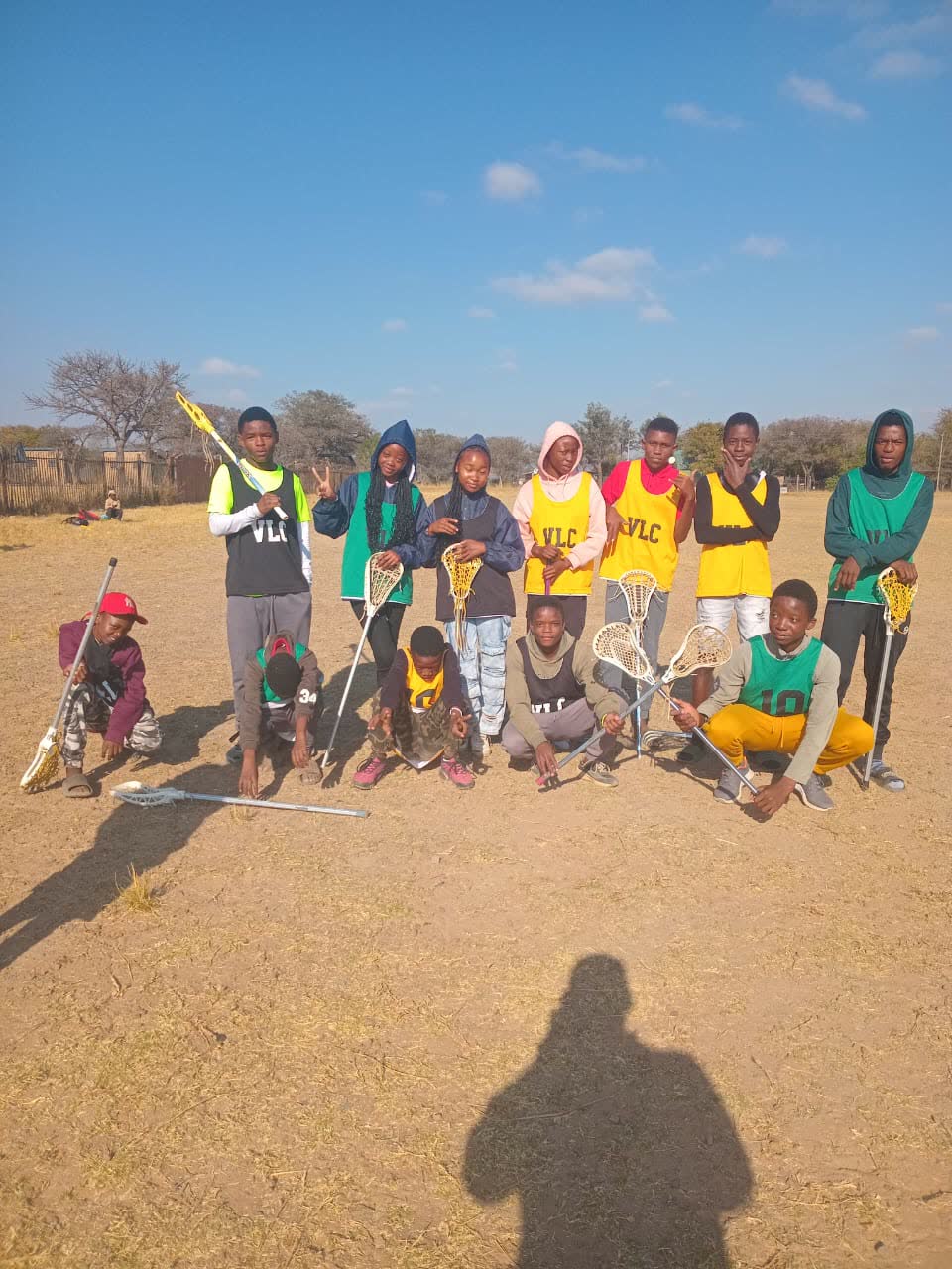 A Vaalwater Lacrosse Club squad photo on the field